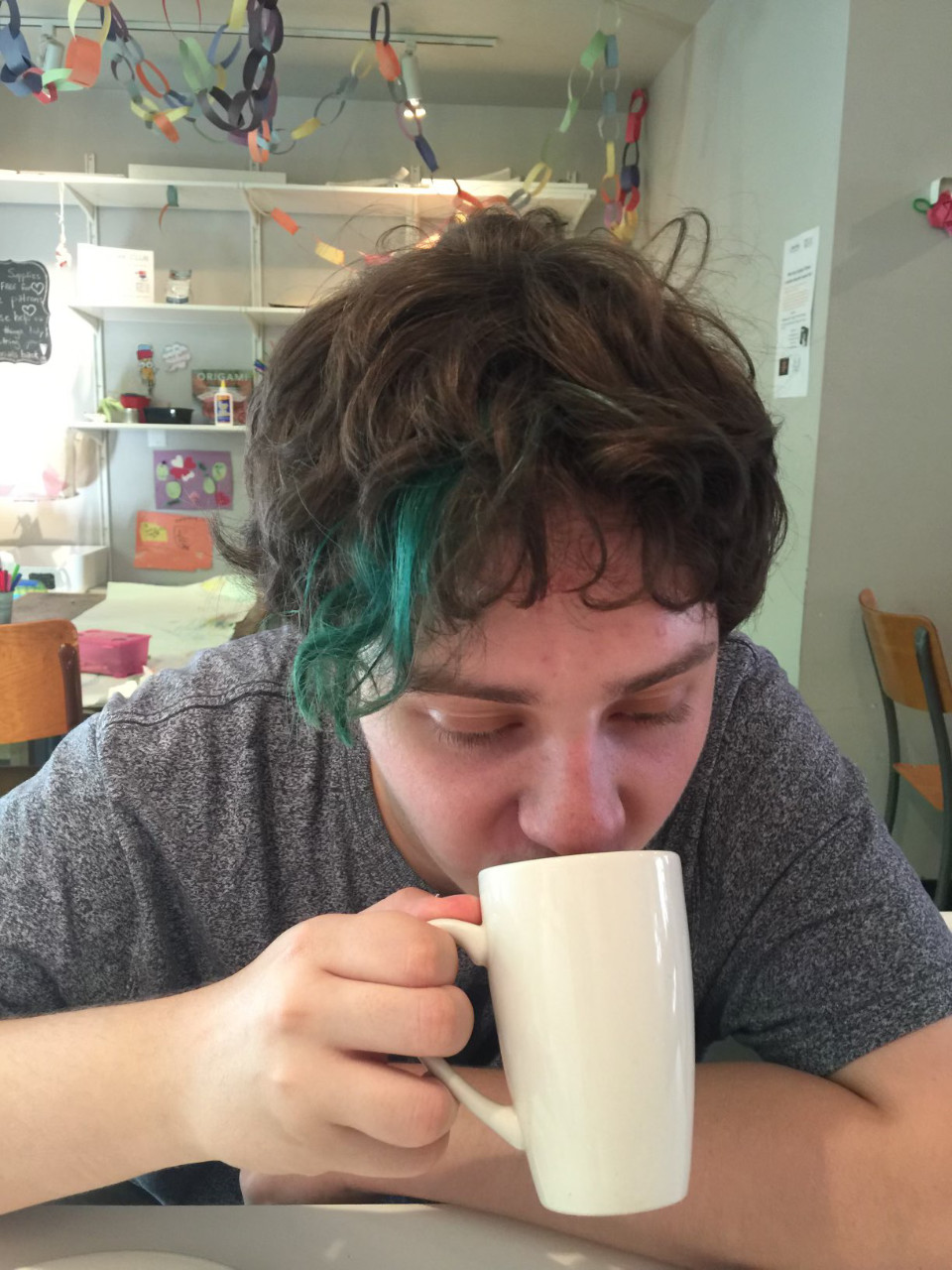 Matthew Thoms, age 16, drinking a chai latte at a downtown Toronto tea shop.